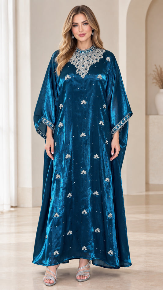 Front view of model wearing full-length teal blue embellished velvet kaftan maxi dress
