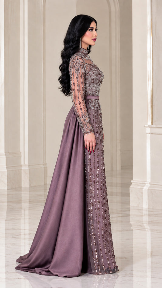Side view of dusty mauve formal gown showing long sleeves and satin train