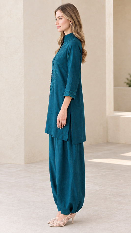 Side profile view of Teal embroidered tunic and pants set