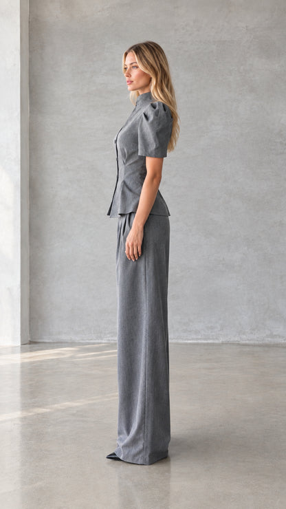 Side view of model wearing grey tailored short sleeve pant suit set