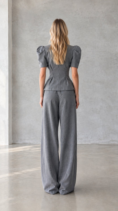 Back view of grey peplum top and wide leg trousers set
