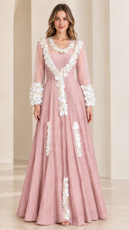 Front full-length view of dusty rose pink formal gown with sheer sleeves and white petal trim